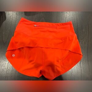 Orange Lululemon High Rise 2.5” lined shorts